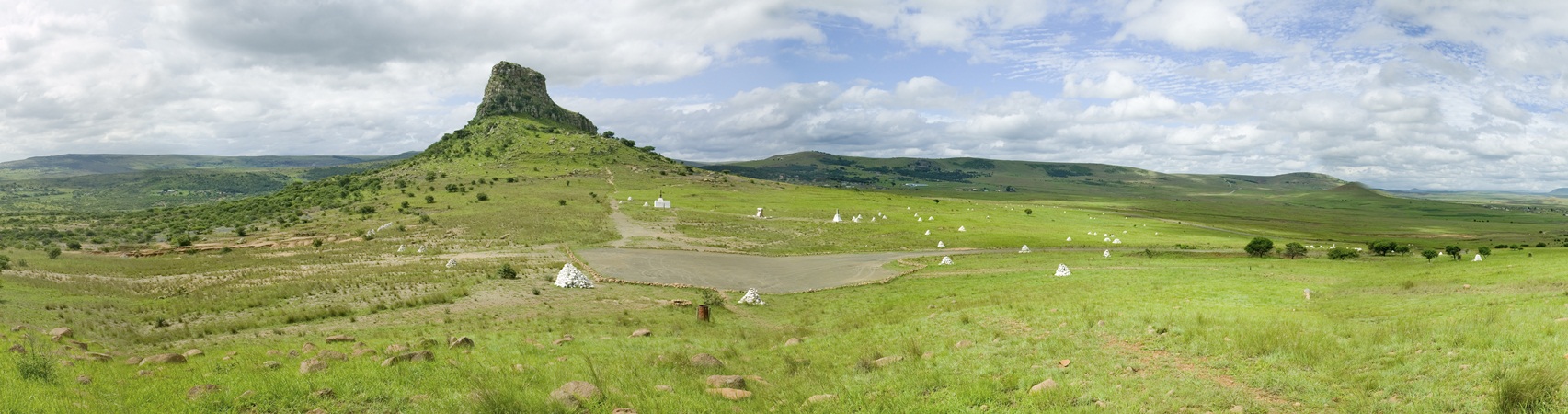 Panoramic view of Sandlwana hill or Sphinx with soldiers graves in foreground, the scene of the Anglo Zulu battle site of January 22, 1879. The great Battlefield of Isandlwana and the Oskarber, Zululand, northern Kwazulu Natal, South Africa